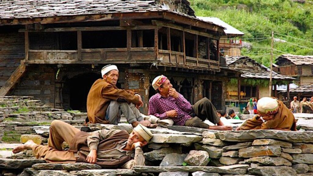 Traditional Kath-Kuni homes alongside modern development in Himachal Pradesh