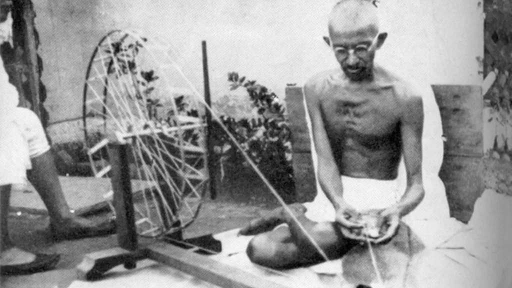 mahatma gandhi spinning khadi on a charkha