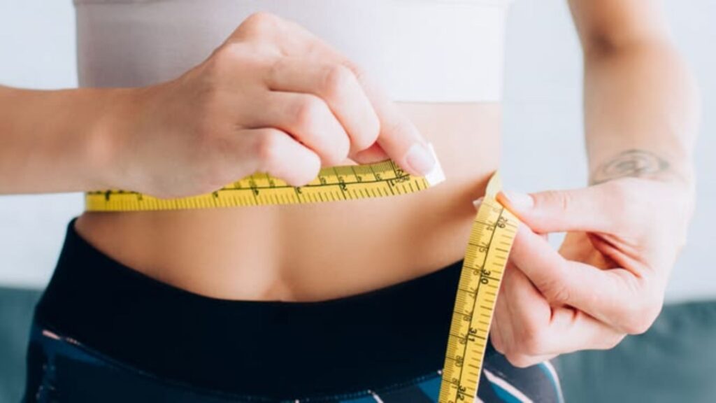Weight loss progress measured by scale and waist measurement